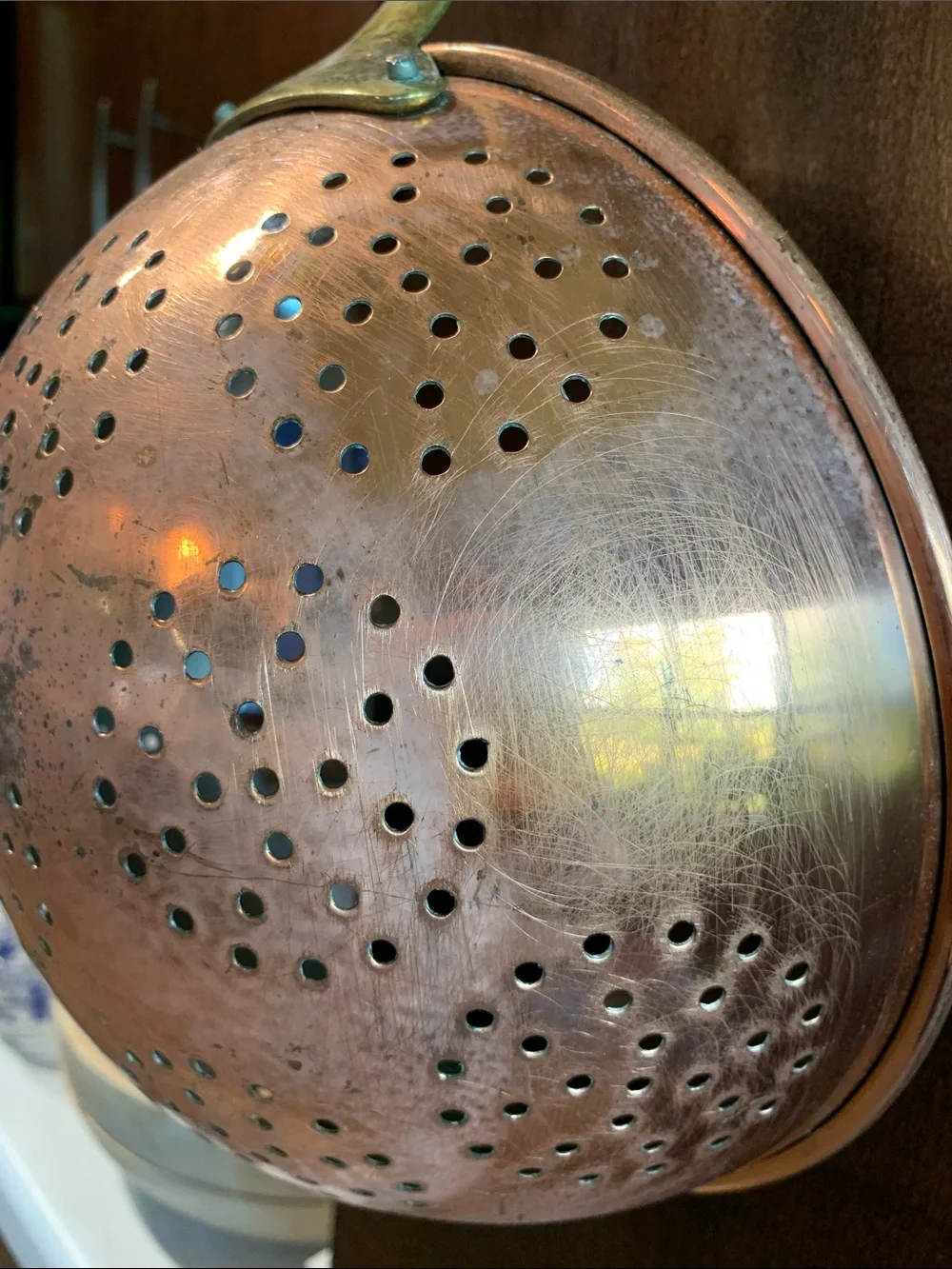 vintage copper colander strainer with a long brass handle 16”L